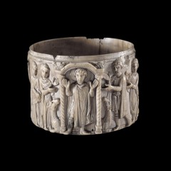 Small carved cup showing St Menas
