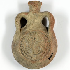 Small pottery flask. With a round stamp showing St Menas.