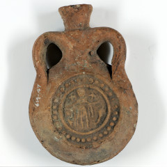 Small pottery flask. With a round stamp showing St Menas.
