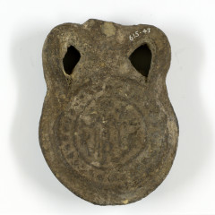 Small broken pottery flask. With a round stamp showing St Menas.