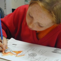 A young girl colouring in at York Art Gallery