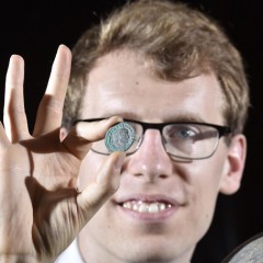 York Museums Trust's curator of numismatics Dr Andrew Woods with one of the coins from the Wold Newton Hoard (image © Anthony Chappel-Ross)