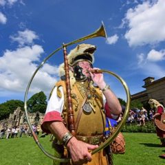 Man dressed as a Roman bugle player