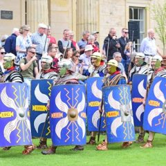 Group of Roman re-enactors with blue shields