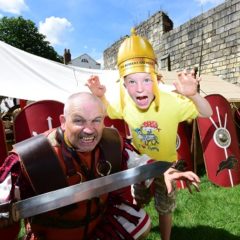 Roman soldier and young boy looking fierce