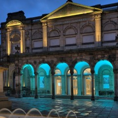 York Art Gallery at night. The entrance has been illuminated blue.