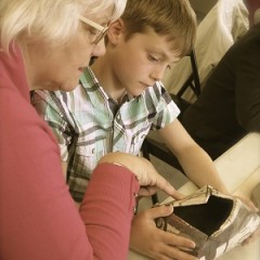 A grandmother and grandson enjoying hands-on activities