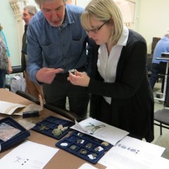 Finds Liaison Officer Rebecca Griffiths discussing objects with their finder