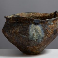 Brown and green uneven ceramic bowl