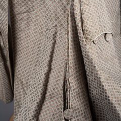 Pleating detail in floral patterned fabric on gentleman's frock coat from 1700s