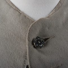 Close up of decorative button on men's 18th century jacket