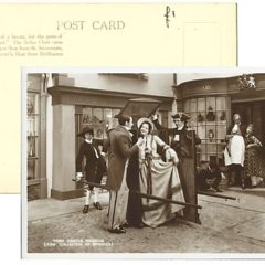Postcard with black and white old fashioned photo of a Victorian street with costumed characters