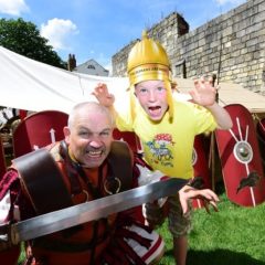 Man and boy dressed as Romans