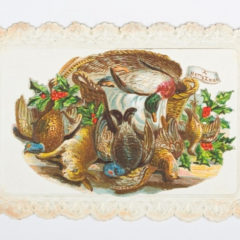 An illustration of a wicker basket surrounded by holly, ivy and dead animals. A piece of paper saying 'A Merry Xmas' is stuck to the basket.