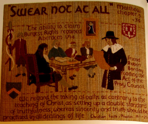 A textile illustration called 'Swear Not At All'. It includes a Quaker man reading from a parchment to five men.