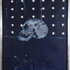 Black painting with a skull in the middle. The upper half of the work has a series of white dots. The work is framed in a silver border.