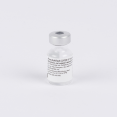 A vial of vaccine on a plain white background