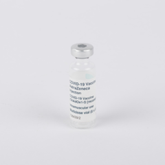 A Vial of vaccine on a plain white background